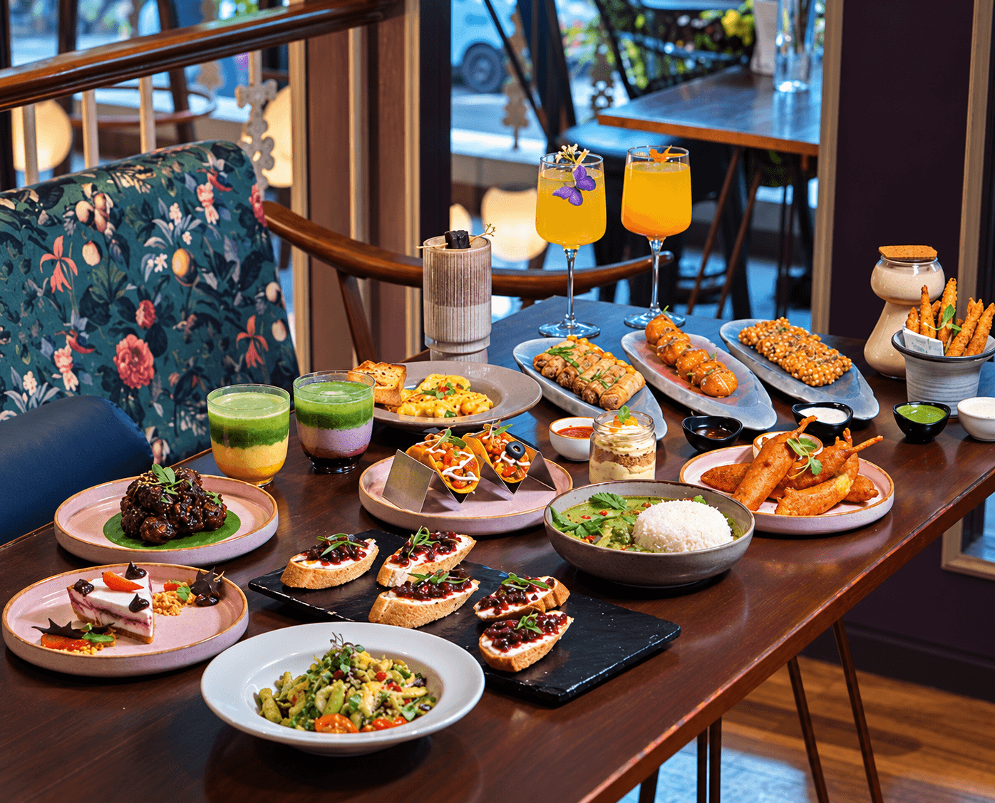 A generous table spread of Tea Villa dishes and drinks