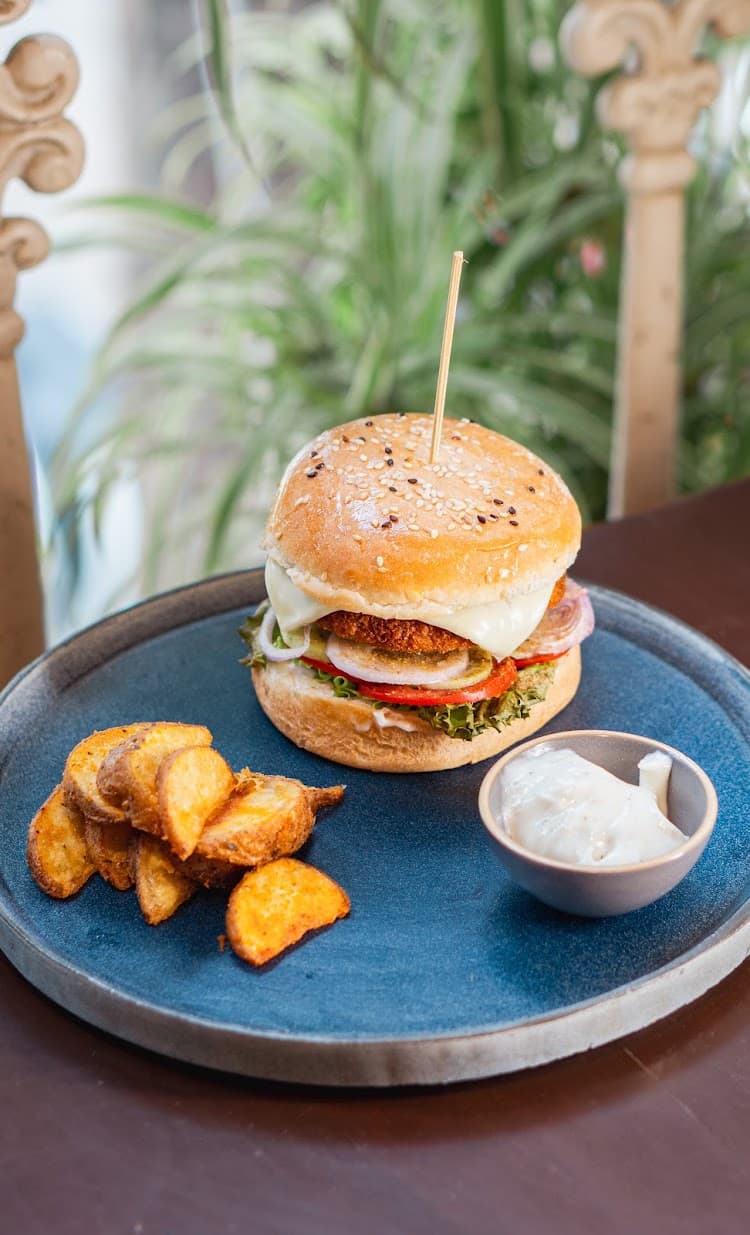 Vegetarian burger with seasoned potato wedges